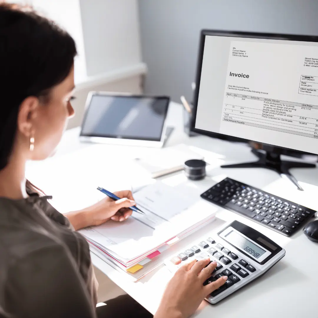 Bookkeeping records and calculator on an office desk